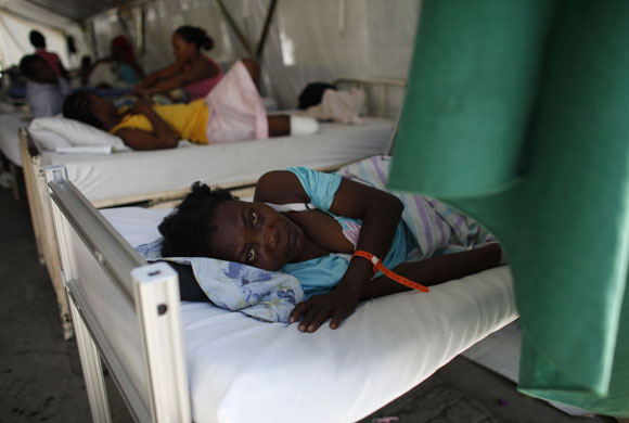 Haiti: 2 February: A woman waits to be attended by a doctor