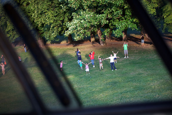 London's Air Ambulance: Children in a park in South London wave at the London Air Ambulance