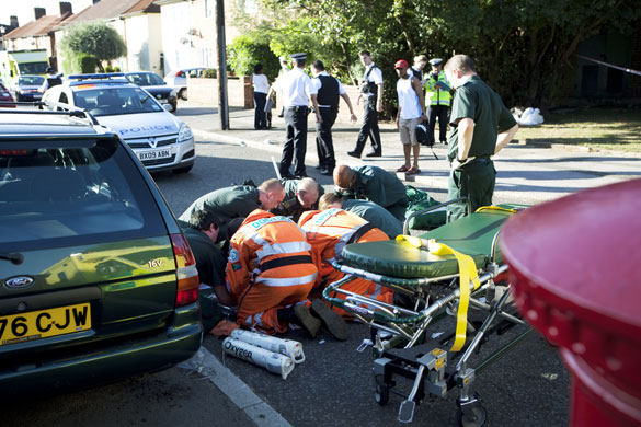 London's Air Ambulance: Doctors, paramedics and London's Air Ambulance treat a boy in the road
