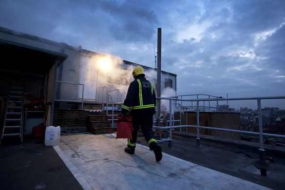 London's Air Ambulance: Fire crew returns after the helicopter takes off at the end of the day
