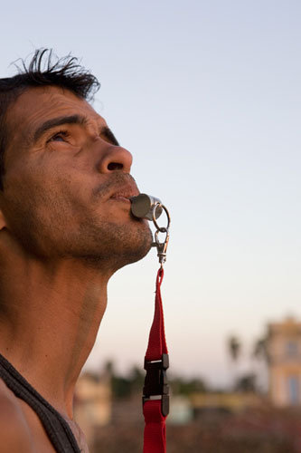 Cuban Stories: Michel Palacio Colina uses a whistle to call to his pigeons