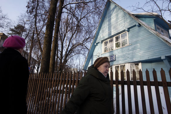 Sokol Village Moscow: People walk past an old house at the Sokol Village