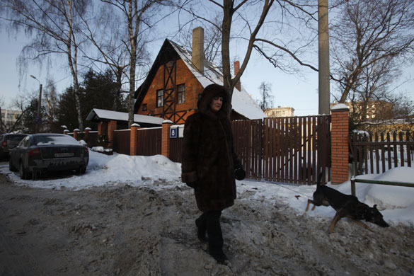 Sokol Village Moscow: People walk past an old house at the Sokol Village