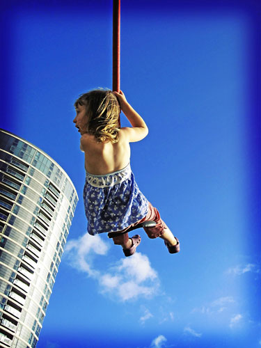 Readers' pics: exercise: Young girl exercising on a swing