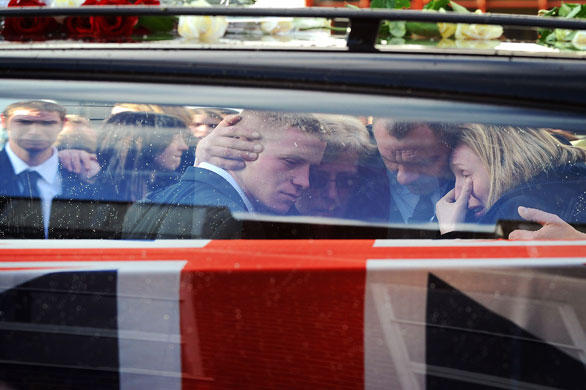 24 Hours in Pictures: Hearses carrying the coffins of two British soldiers drive past