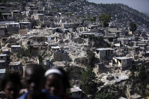 24 Hours in Pictures: Collapsed houses are seen at a hill in Port-au-Prince