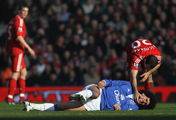 Merseyside Derby:  Javier Mascherano of Liverpool checks on Marouane Fellaini