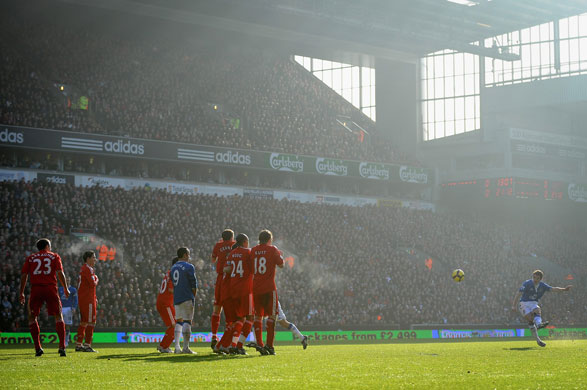 Merseyside Derby: Leighton Baines of Everton takes a free kick 