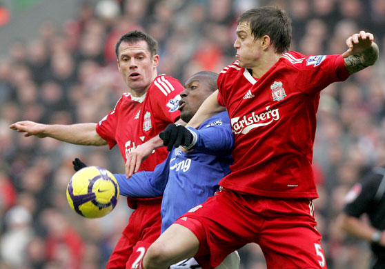 Merseyside Derby: Jamie Carragher and Daniel Agger vie for the ball against Everton's Yakubu