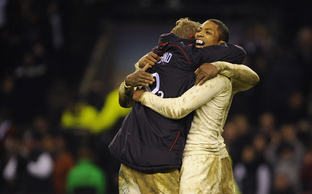 England Wales: Delon Armitage celebrates the victory with Lewis Moody and Ugo Monye