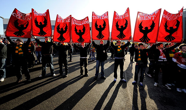7 February 2010: Manchester, UK: Manchester United fans take part in a minute's silence
