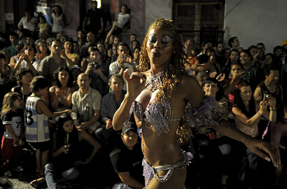 7 February 2010: Montevideo, Uruguay: People watch a candombe dancer