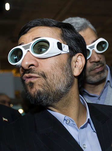 7 February 2010: Tehran, Iran: President Mahmoud Ahmadinejad wears protective glasses