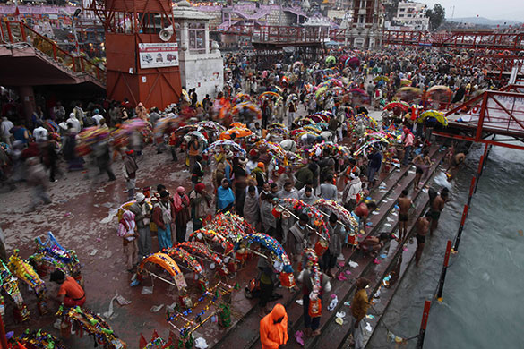 24 hours in pictures: Haridwar, India: Kanwarias prepare to take holy dip in the river Ganges