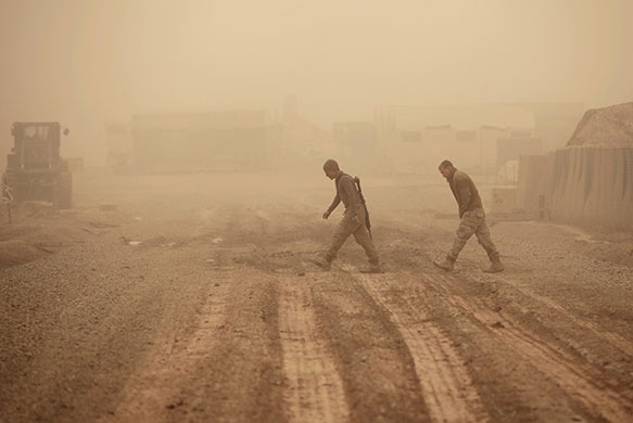 24 hours in pictures: Marjah in Nad Ali, Afghanistan: US Marines during a dust storm