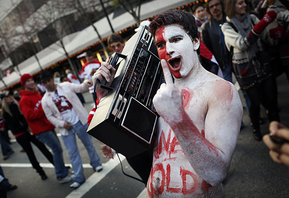 24 hours in pictures: Vancouver, Canada: A Canadian fan celebrates their gold medal victory