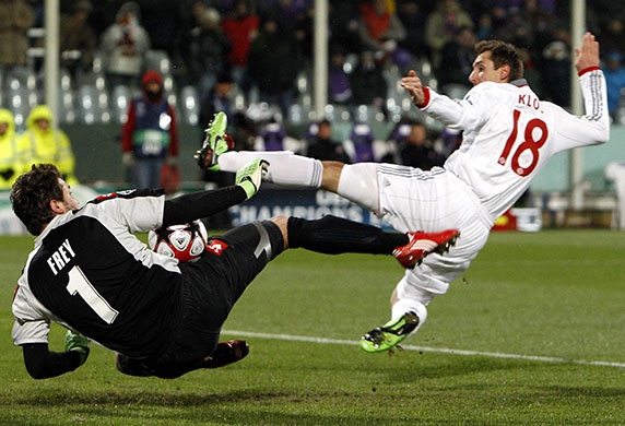Tuesday: Bayern Munich's Klose fights for the ball with Fiorentina's goalkeeper Frey
