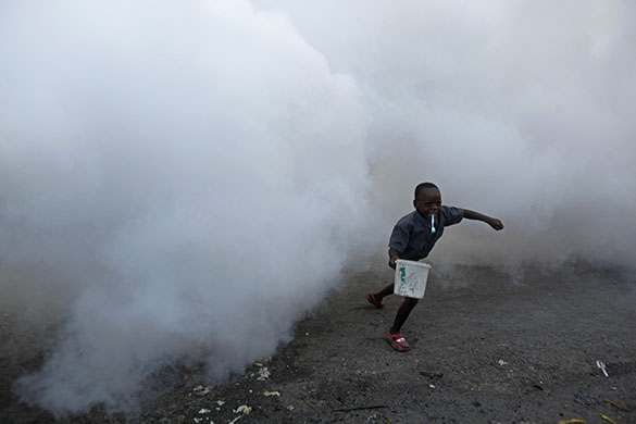 24 hours in pictures: makeshift camp for earthquake survivors is fumigated in Haiti