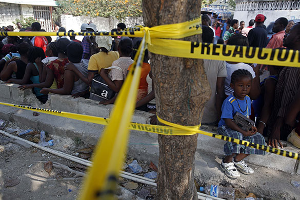 24 hours in pictures: Port-au-Prince, Haiti: A line of people waiting to receive aid