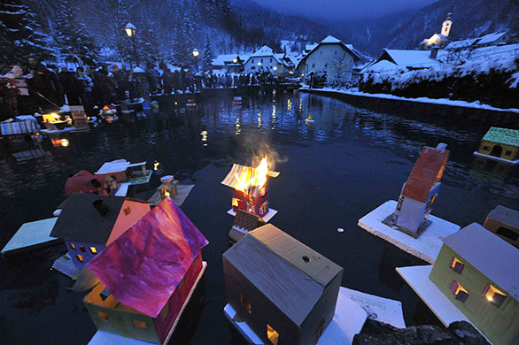 24 hours in pictures: Floats lit with candles on a river in Kropa on St Gregory's day