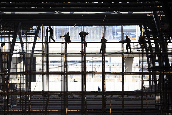 24 hours in pictures: Migrant labourers work at Hongqiao Airport in Shanghai