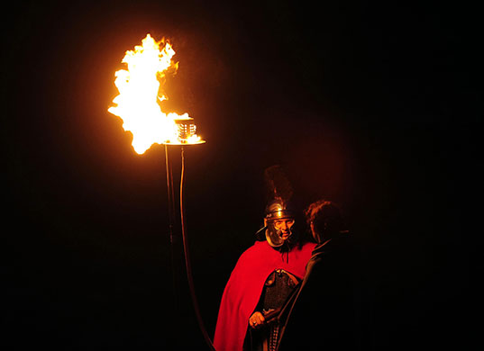 Hadrian's Wall: Spectators, some dressed as Roman soldiers on the Pennine hillsides