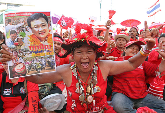 Thailand protests: Supporters of former Thai premier Thaksin Shinawatra shout slogans