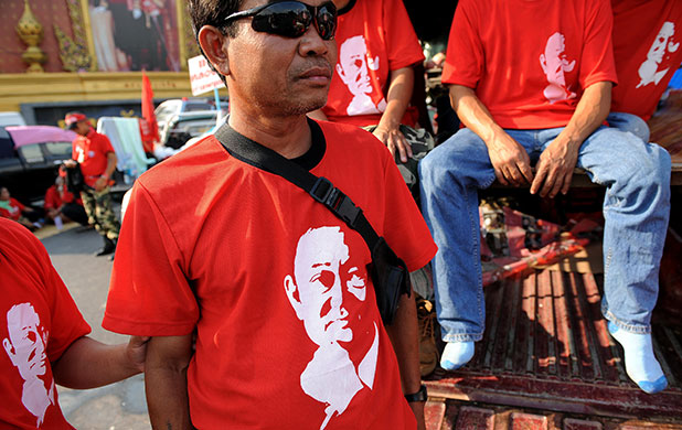 Thailand protests: Supporters of deposed Thai premier Thaksin Shinawatra wear t-shirts