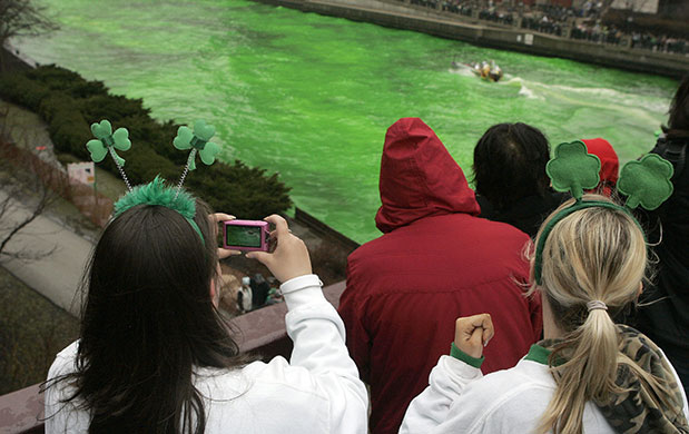 24 hours: Chicago, USA: Spectators watch as the Chicago River is dyed green