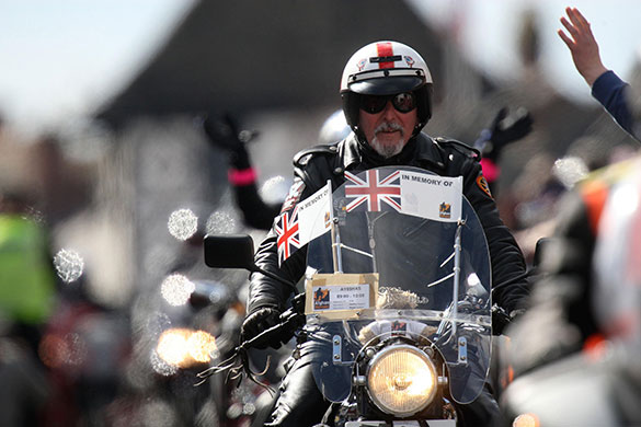 Wootton Bassett bikers: Bikers ride through Wootton Bassett during a mass motorcycle ride