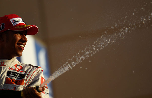 Bahrain Grand Prix: Third placed Lewis Hamilton celebrates on the podium 