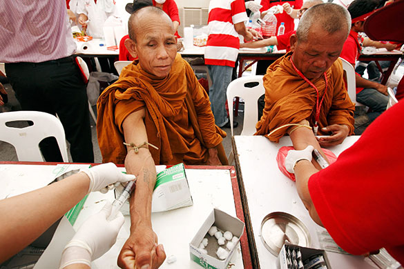 Thailand blood protest: Thai Buddhist monks donate blood at a protest site