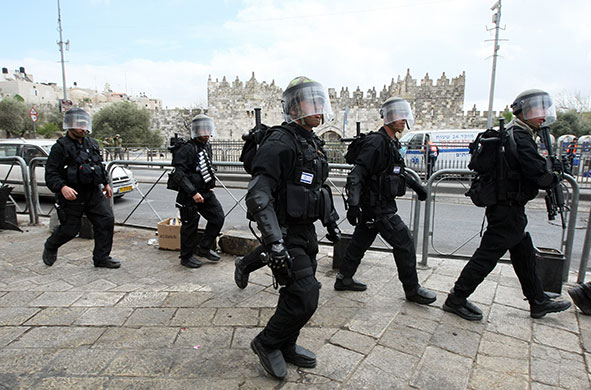 East Jerusalem protests: Israeli riot police patrol during clashes with Palestinian demonstrators 