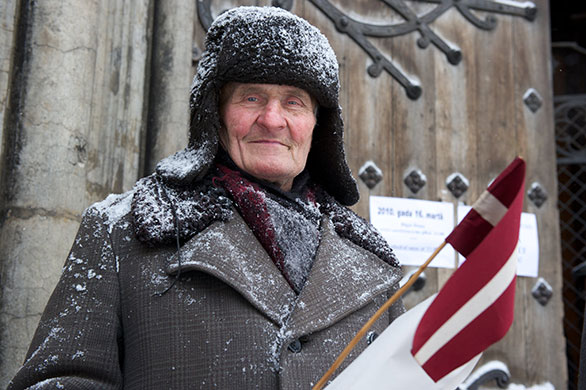 Legionnaires' Day Latvia: A Latvian Legion veteran walks to the Monument of Freedom 