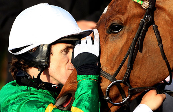 Cheltenham Tuesday: Tony McCoy celebrates his victory with his mount, Binocular