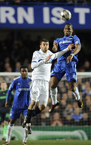 Chelsea v Inter: Didier Drogba rises high above Thiago Motta to easily win a header