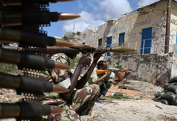 24 hours in pictures:  Somalian government soldiers hold a position March