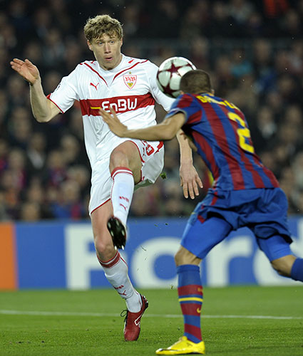 Champions League: Barcelona's defender Dani Alves heads the ball clear