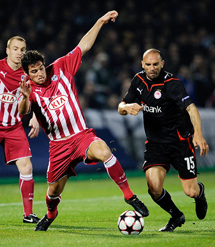 Champions League: Bordeaux's Yoann Gourcuff dives in to tackle Olympiakos's Raul Bravo