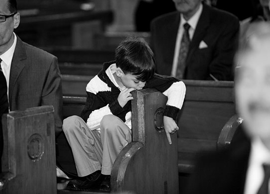 In Pictures: boredom: boy at a wedding
