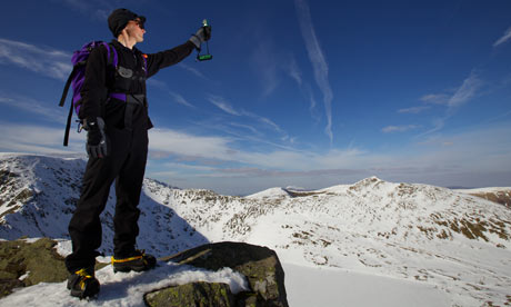 Jon Bennett measures temperature and wind speed atop Helvellyn, the third highest English peak