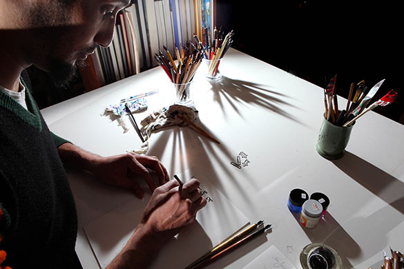 Disappearing Acts: Master calligrapher Paul Antonio in his calligraphy studio