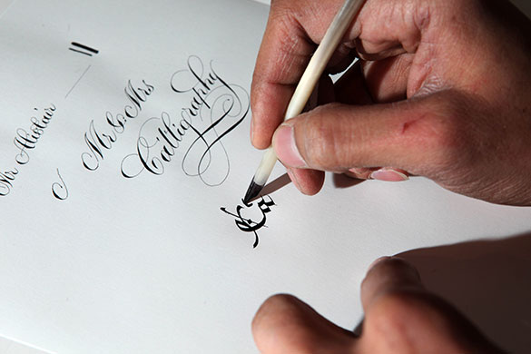 Disappearing Acts: Calligrapher Paul Antonio with pens ink and paper in his studio