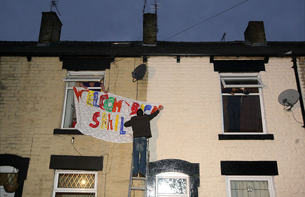 sahil saeed: Neighbours hang out a banner to welcome home Sahil Saeed