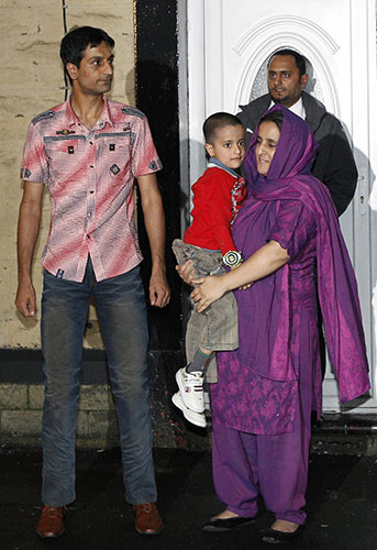 sahil saeed: Sahil Saeed with his mother and father at home in Oldham