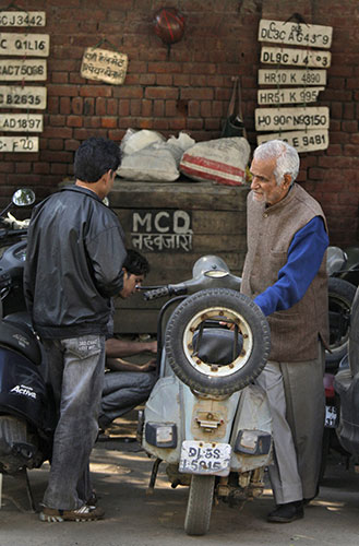Bajaj scooter: An elderly person with his Bajaj scooter