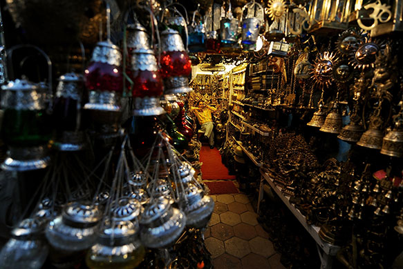 24 hours in pictures: An Indian shopkeeper waits for customers New Delhi