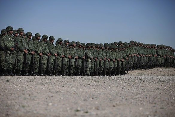 24 hours in pictures: Soldiers stand in line Ciudad Juarez, Mexico