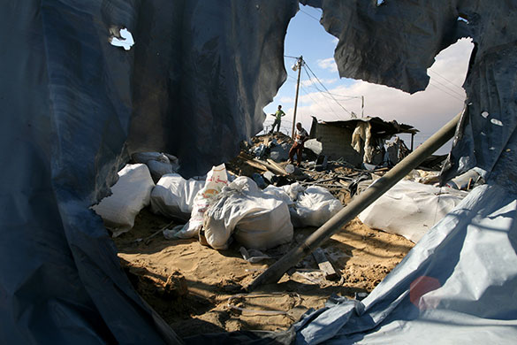 24 hours in pictures: Palestinians inspect damage following Israeli air strikes Gaza Strip