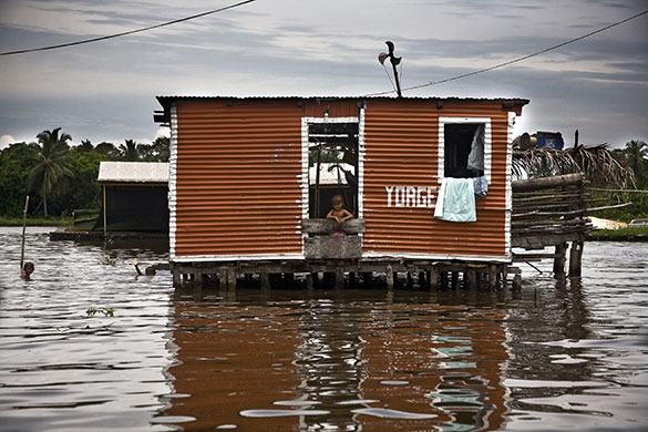Venezuela lightning: Children play in the waters of Lake Maracaibo at Congo Mirador